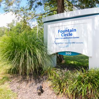 Welcome to Fountain Circle, a community space surrounded by lush greenery.