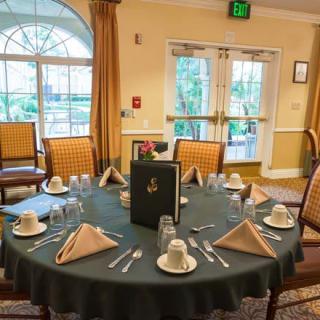 A neatly arranged dining table in an elegant restaurant setting.