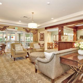 A cozy living room interior with comfortable seating and elegant decor.