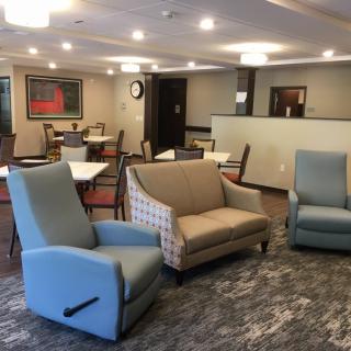 A cozy lounge area with comfortable seating and modern decor.