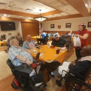Residents enjoying a social gathering in a community dining area.