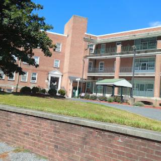 A sunny view of a residential apartment building.