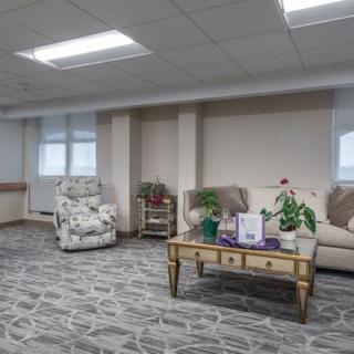 A cozy waiting room with comfortable seating and tasteful decor.