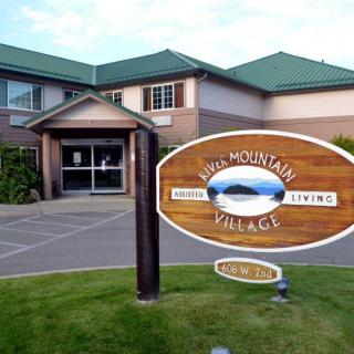 Entrance to a retirement living facility with a welcoming sign.
