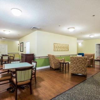 A cozy dining and leisure area with tables, chairs, and comfortable seating.
