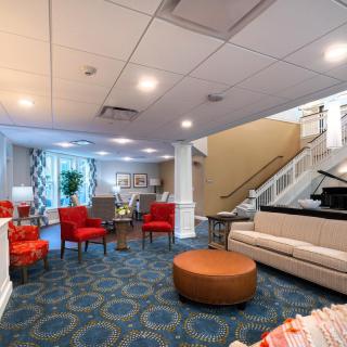A modern lobby with colorful seating and stylish decor.