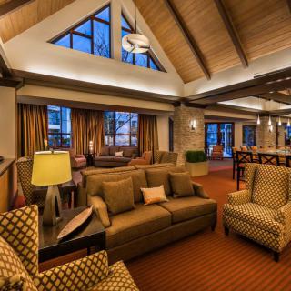 A cozy hotel lobby with comfortable seating and warm lighting.