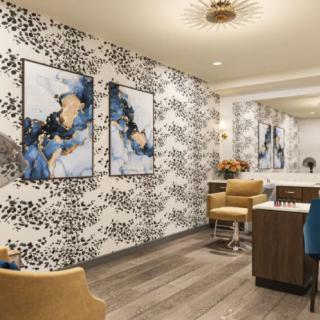 A stylishly decorated interior space featuring abstract artwork and modern furniture.