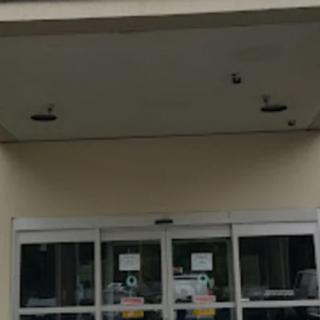Entrance of a building with sliding glass doors.