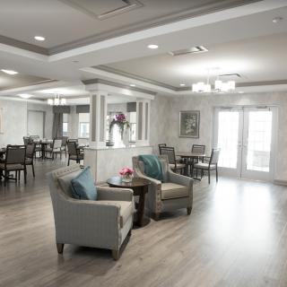 A modern living room with comfortable seating and elegant lighting.