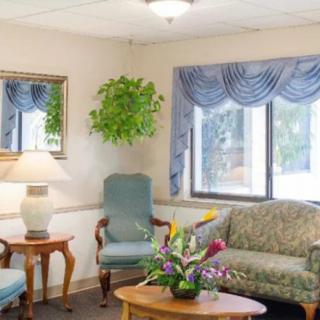 A cozy living room with comfortable seating and decor.