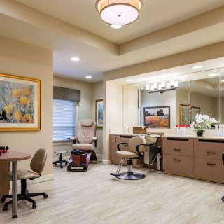 A well-lit beauty salon with comfortable chairs and stylish decor.