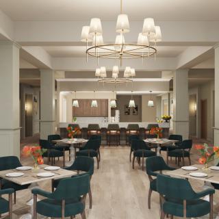 A modern restaurant dining area with neatly arranged tables and chairs under elegant lighting.