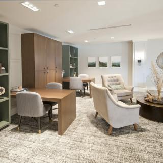 A modern office space with elegant furniture and neutral decor.