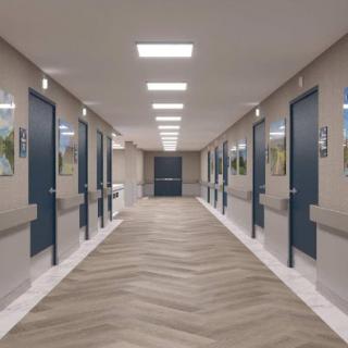 A modern interior hallway featuring multiple doors and bright lighting.