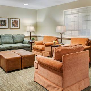 Cozy living room with comfortable seating and soft lighting.