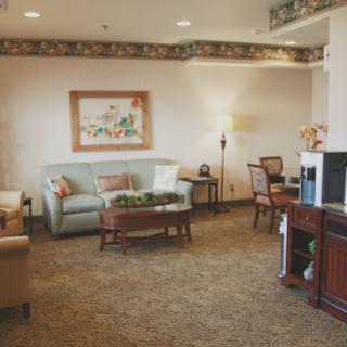 A cozy lobby area featuring comfortable seating and tasteful decor.