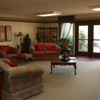 A cozy living room with comfortable seating and elegant decor.