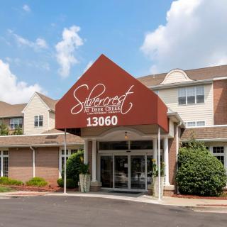 Front entrance of a hotel with a welcoming awning.