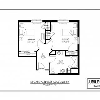 A detailed floor plan of a residential unit with two bedrooms, a living area, and bathrooms.