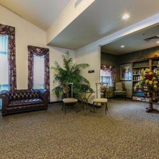 A cozy lobby area with elegant furniture and decorative elements.