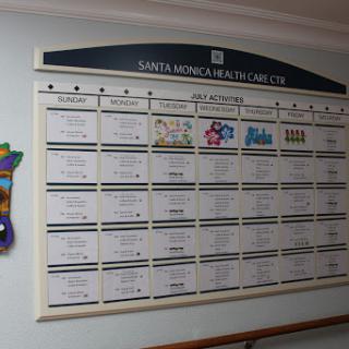 A healthcare facility's scheduling board displaying various activities and events.