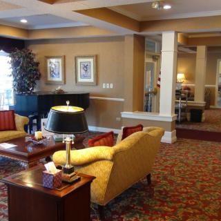 A cozy hotel lobby with comfortable seating and warm lighting.