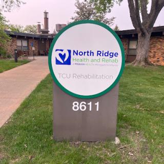 Sign for North Ridge, indicating the address 8611.