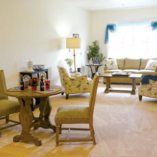 A cozy living room with elegant furniture and decor.