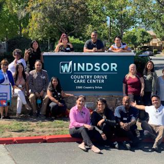 Staff and community members gathered at the Windsor Country Drive Community Center.