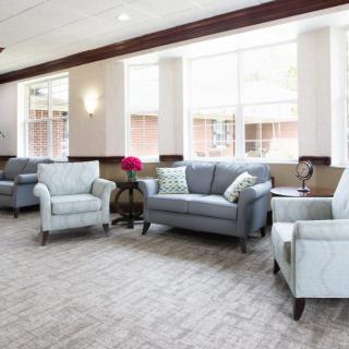 A bright lobby with comfortable seating and large windows.