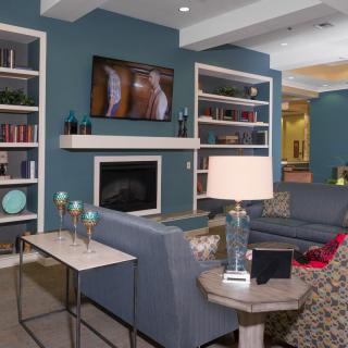 Modern living room with cozy seating and stylish decor.