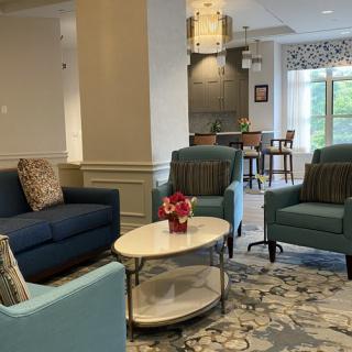 A cozy living room setting with comfortable seating and tasteful decor.