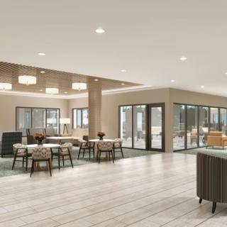A modern and spacious interior with ample seating and natural lighting.