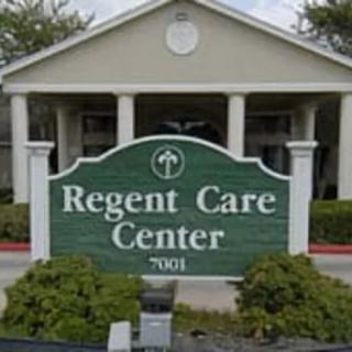 Entrance sign of Regent Care Center with the building in the background.