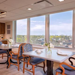 A beautifully designed dining area with large windows offering a scenic view.