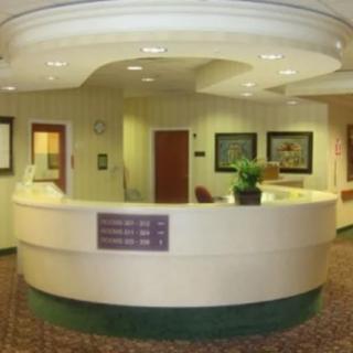 A modern reception desk in an office lobby.