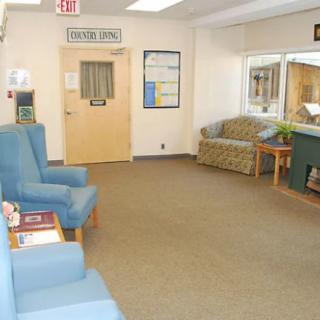A quiet waiting room with comfortable seating and a few magazines.