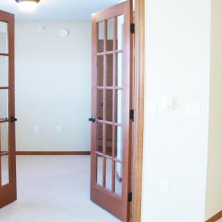A view of an interior space featuring elegant French doors.