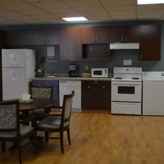 A well-equipped kitchen featuring modern appliances and a cozy dining area.
