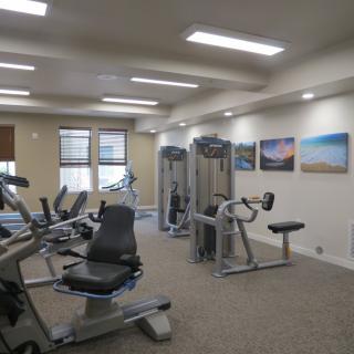 A well-equipped gym with various exercise machines for fitness training.