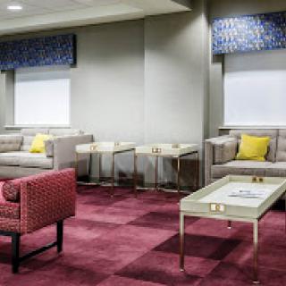 A modern lounge area featuring comfortable seating and stylish decor.
