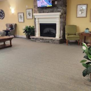 Cozy living room with a fireplace and comfortable seating.