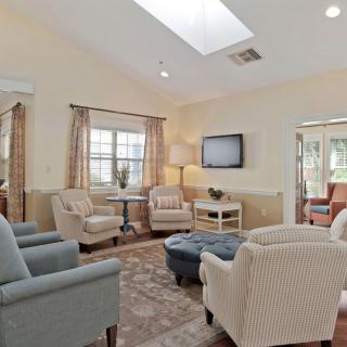 A cozy living room featuring comfortable seating and natural light.