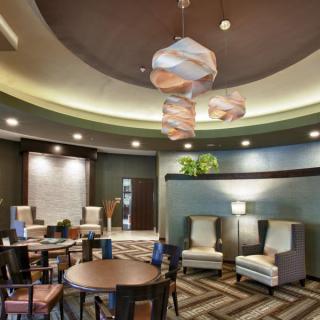 A modern lobby with stylish seating and contemporary lighting fixtures.