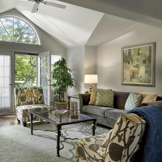 A cozy living room with modern decor and ample natural light.