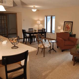 A cozy open-concept living and dining area with modern furniture.
