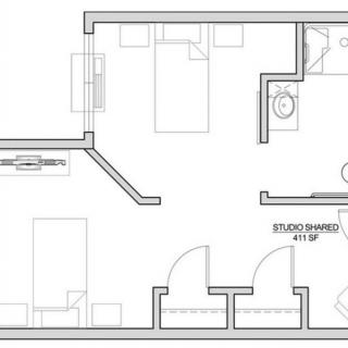 A floor plan layout of a studio apartment featuring a living area, kitchen, and bathroom.