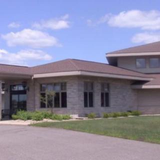 A suburban residential house with a neatly landscaped exterior.