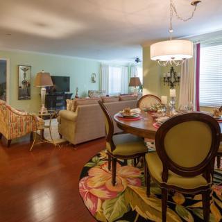 A cozy living and dining area with stylish furniture and warm lighting.